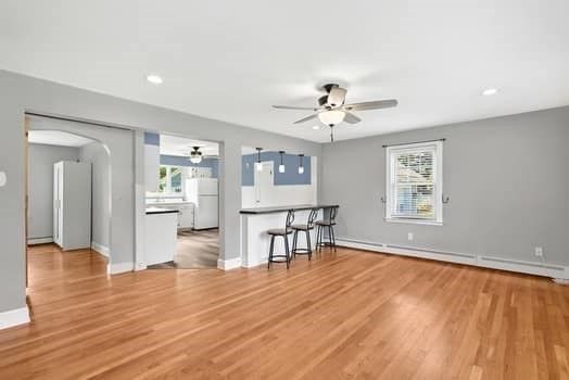 61 East Longmeadow Road Hampden, MA 01036 - Photo 10 of 38 a view of a livingroom with furniture wooden floor and a ceiling fan