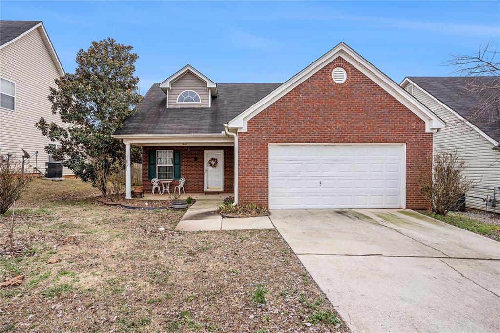 116 Tyler Way Jackson, GA 30233 - Photo 1 of 1 a front view of a house with garden