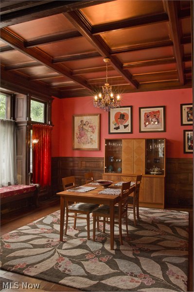 Dining room with oak wainscoting, window seat, and cork flooring with oak parquet banding.