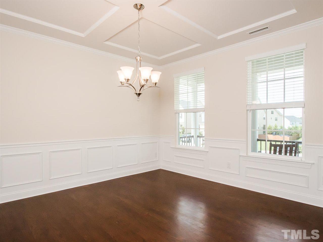 6508 Ridgemount Street Wake Forest, NC 27587 - Photo 10 of 24 The dining room at 6508 Ridgemount features coffered ceiling, crown moulding, chair rail and wainscoting. This room has cable so if you would like to turn it into an office you may do so.