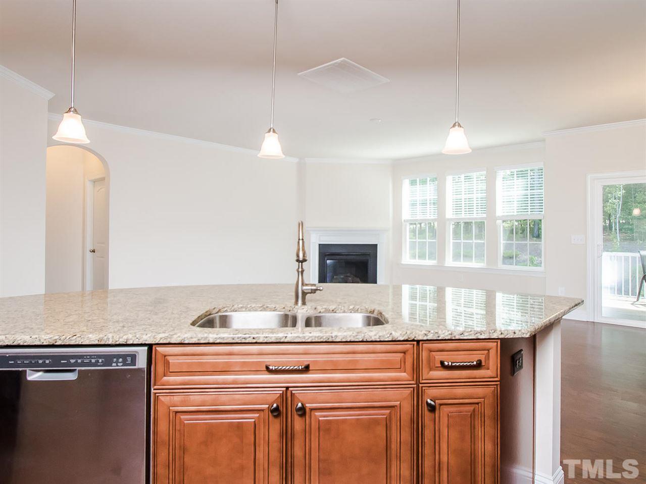 6508 Ridgemount Street Wake Forest, NC 27587 - Photo 24 of 24 View from the kitchen into the family room at 6508 Ridgemount. Be part of the family, watch tv as you prepare your meal or talk to your friends. Best floor plan for entertaining!