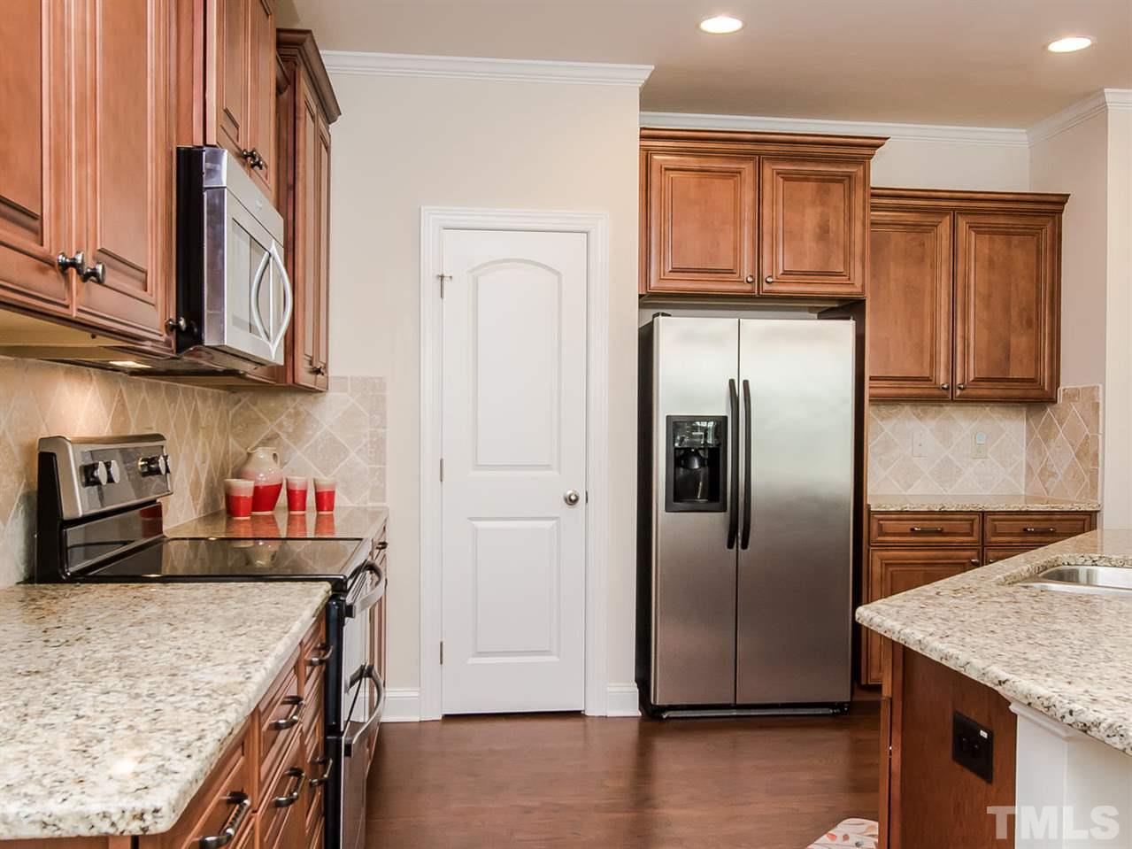 6508 Ridgemount Street Wake Forest, NC 27587 - Photo 13 of 24 This amazing kitchen at 6508 Ridgemount has a large walk-in pantry, stainless appliances and the refrigerator remains with the home. No need to buy new appliances...they are already here.