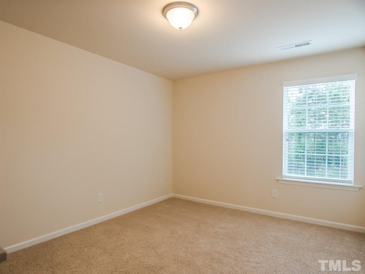 6508 Ridgemount Street Wake Forest, NC 27587 - Photo 17 of 24 Bedroom two is located on the second floor. It has a large spacious closet with scuttle to attic.