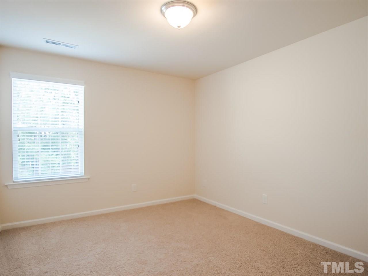 6508 Ridgemount Street Wake Forest, NC 27587 - Photo 19 of 24 Bedroom three is located on the second floor. This room has a large closet. Attic space is located through the closet that leads to the HVAC system.
