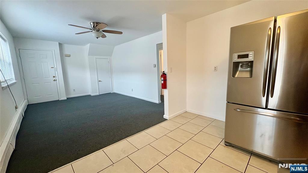 299 Main Street, Unit 7 Lodi, NJ 07644 - Photo 5 of 14 a view of empty room with wooden floor