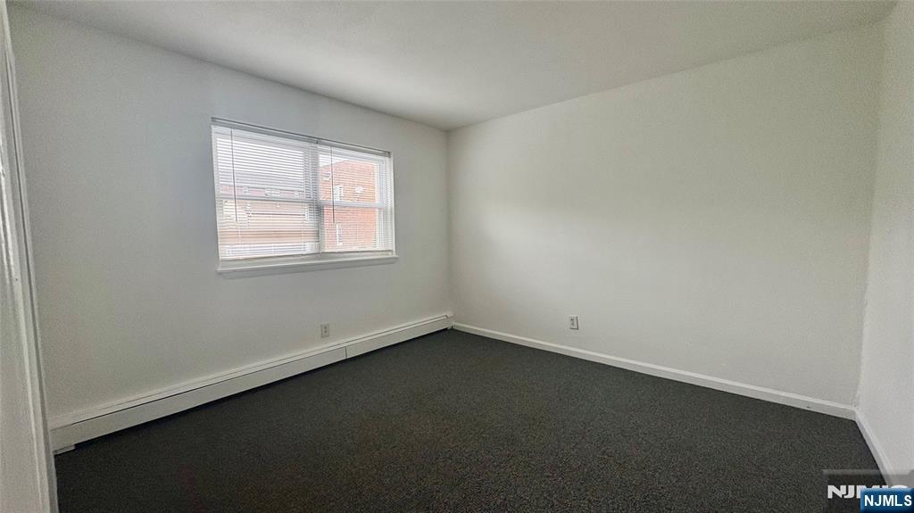 299 Main Street, Unit 7 Lodi, NJ 07644 - Photo 9 of 14 an empty room with a window