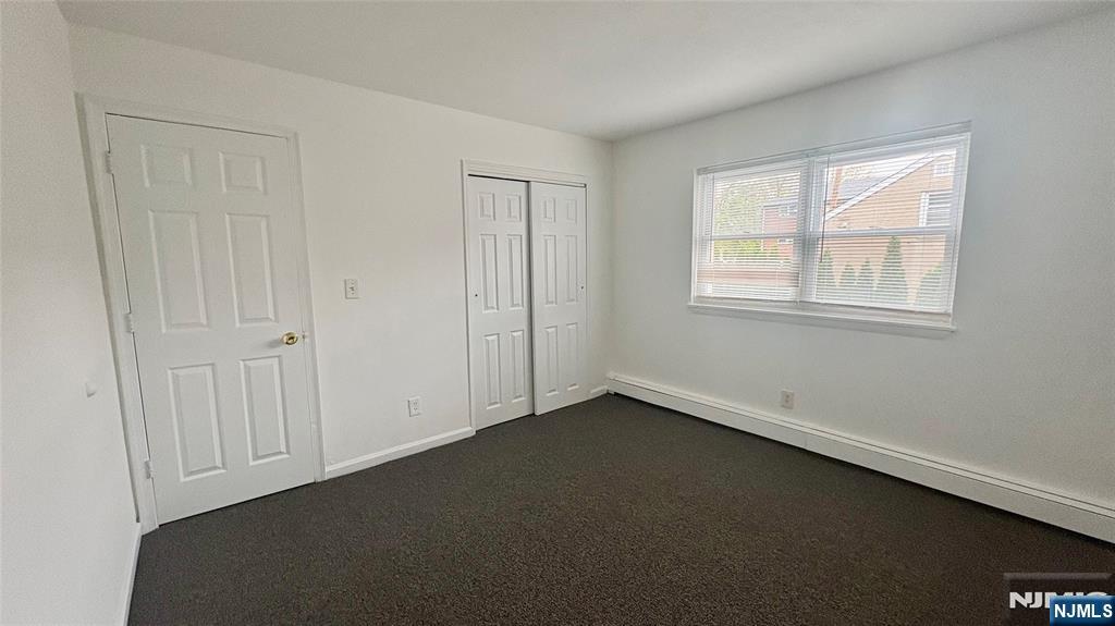299 Main Street, Unit 7 Lodi, NJ 07644 - Photo 10 of 14 an empty room with a window