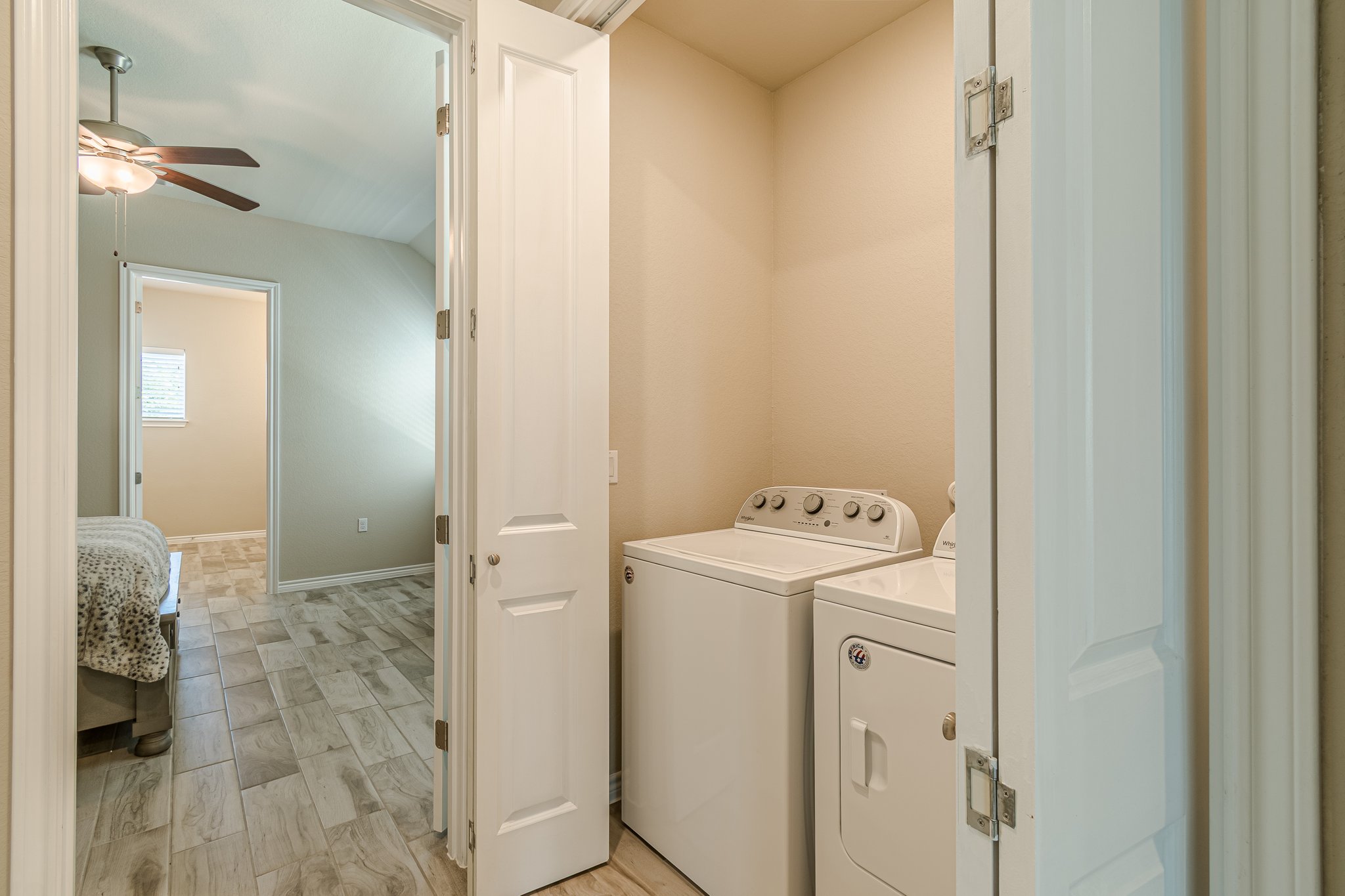 108 Lafitte Drive, Unit 102 San Marcos, TX 78666 - Photo 18 of 27 Washroom with a ceiling fan and washer and dryer