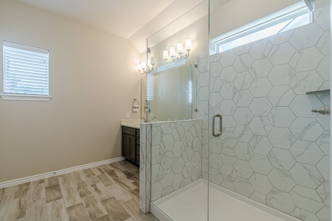 1330 Wonder World Drive, Unit 102 San Marcos, TX 78666 - Photo 23 of 27 a bathroom with a shower
