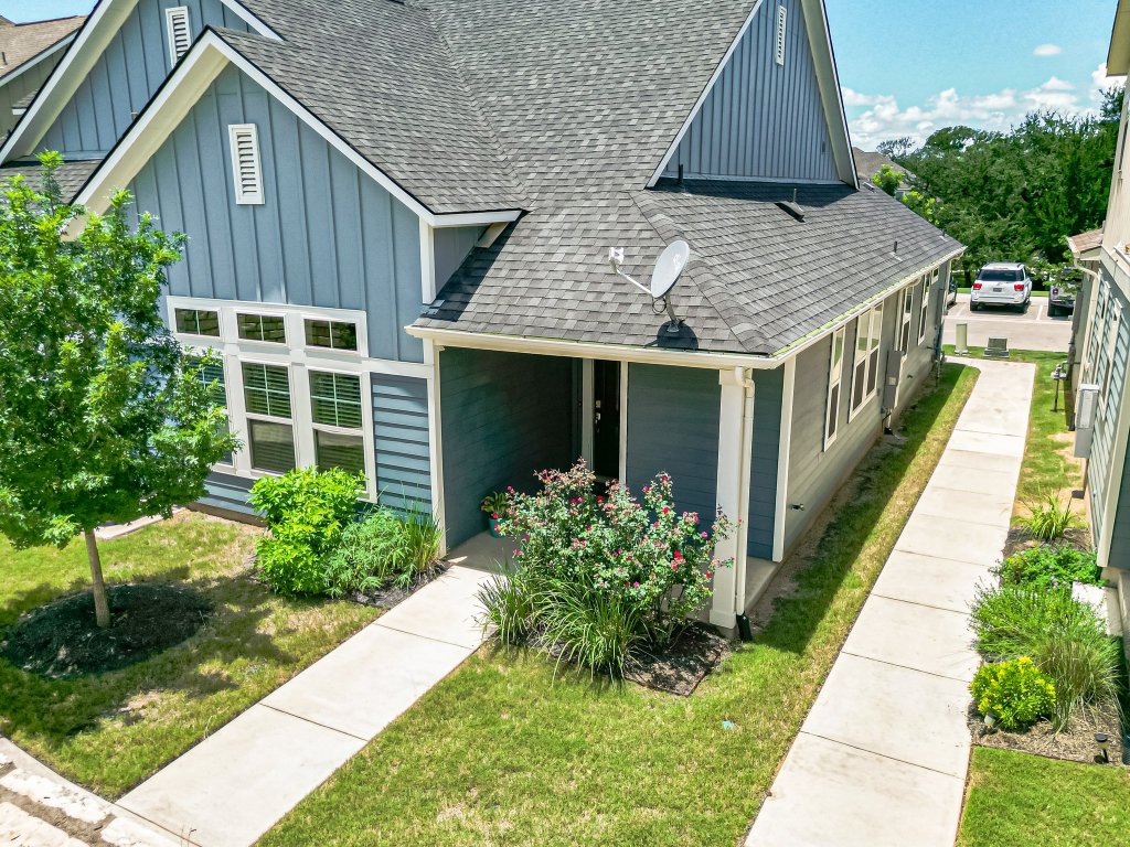 1330 Wonder World Drive, Unit 102 San Marcos, TX 78666 - Photo 3 of 27 a aerial view of a house with a yard and potted plants
