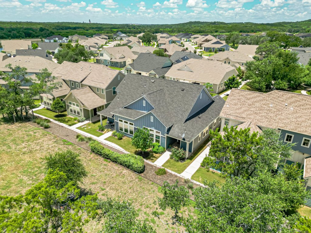 1330 Wonder World Drive, Unit 102 San Marcos, TX 78666 - Photo 4 of 27 an aerial view of a house with a garden