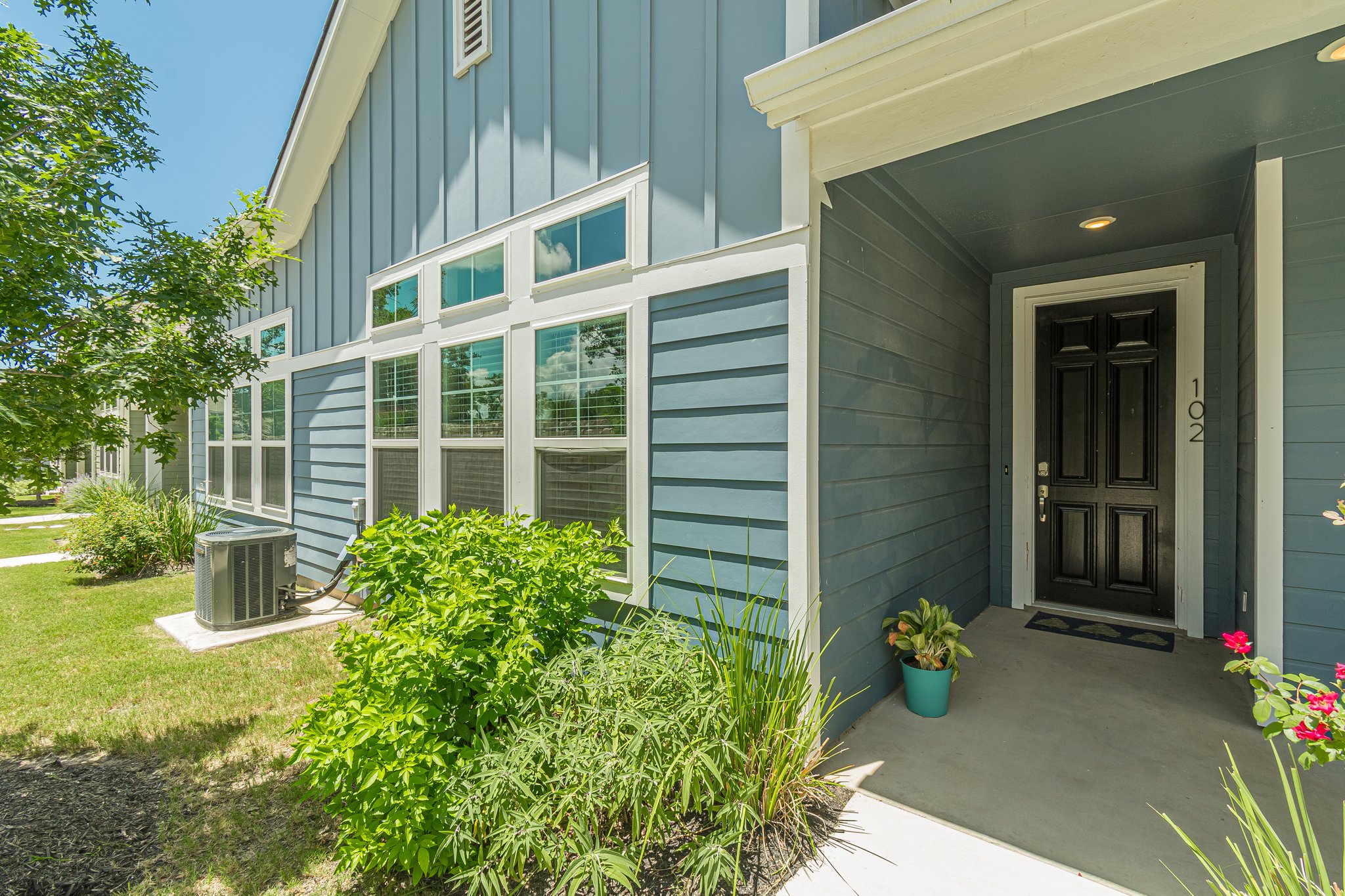108 Lafitte Drive, Unit 102 San Marcos, TX 78666 - Photo 6 of 27 View of exterior entry featuring board and batten siding