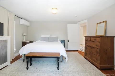 a bedroom with a bed and dresser