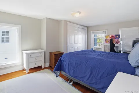 a bed room with a bed and a window