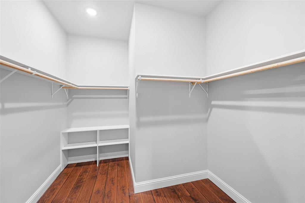 308 Lewis Street Cleburne, TX 76031 - Photo 16 of 20 a view of walk in closet with empty racks