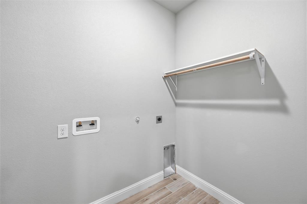 308 Lewis Street Cleburne, TX 76031 - Photo 17 of 20 a view of entryway with wooden floor