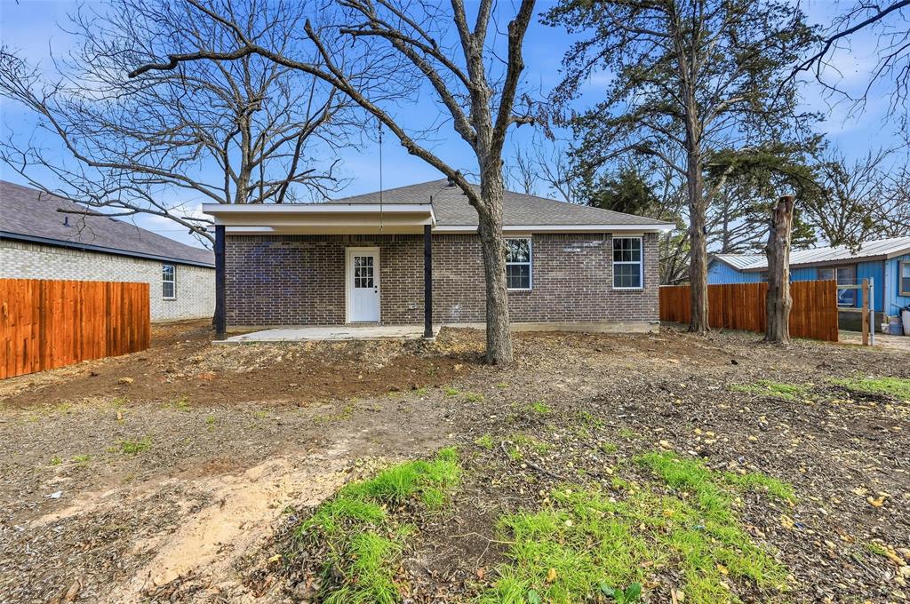 308 Lewis Street Cleburne, TX 76031 - Photo 20 of 20 front view of a house with a yard