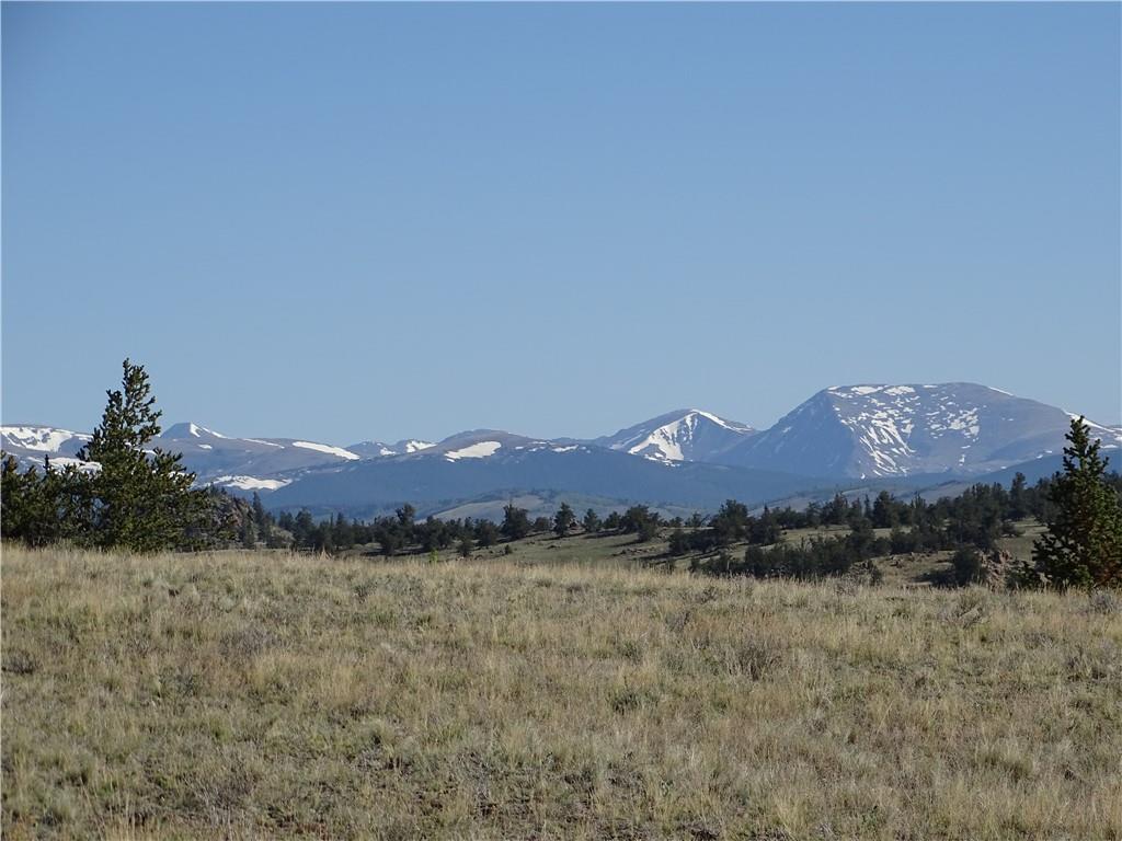 415 Arland Road Como, CO 80432 - Photo 1 of 19 a view of a house with a mountain and a forest