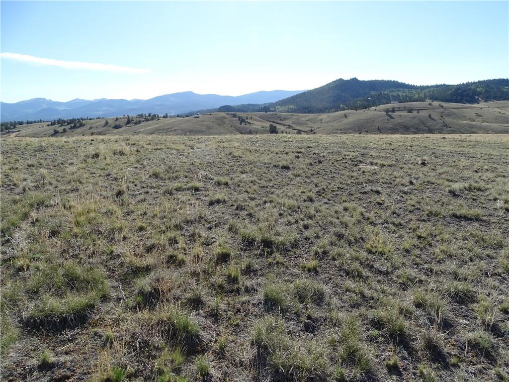 415 Arland Road Como, CO 80432 - Photo 15 of 19 a view of a lush green hillside and a houses