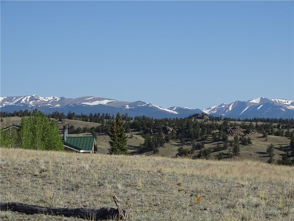 415 Arland Road Como, CO 80432 - Photo 9 of 19 a view of a lake with a mountain in the background