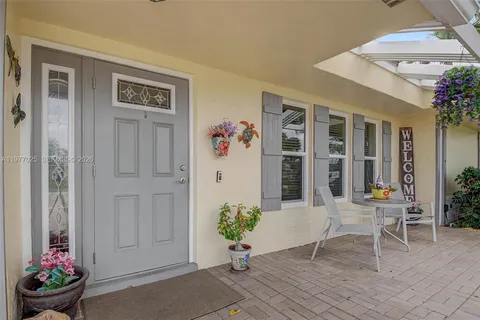 a view of a entryway with flower pots