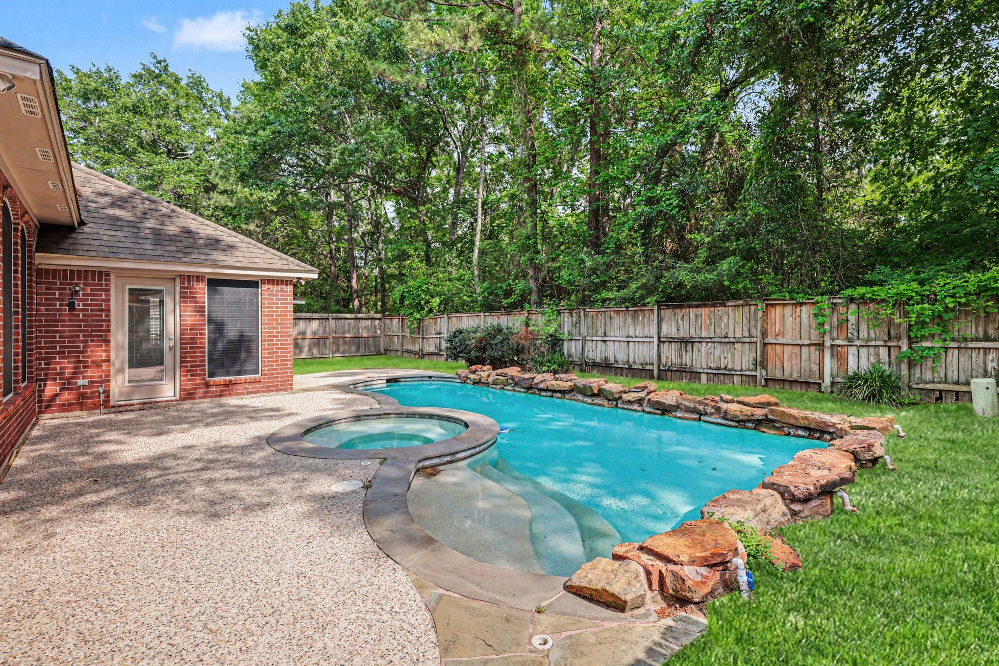 215 Bristol Bend Circle Spring, TX 77382 - Photo 23 of 25 a view of a backyard with table and chairs and a small yard