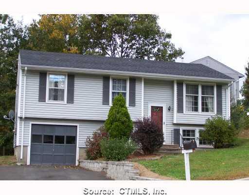 190 Osborn Road Naugatuck, CT 06770 - Photo 1 of 1 a house that has a tree in front of the house