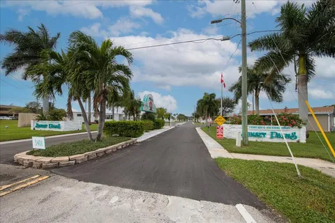a view of a park with palm trees