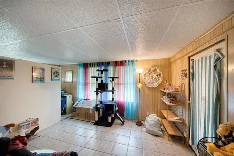 a room with lots of furniture and a large window