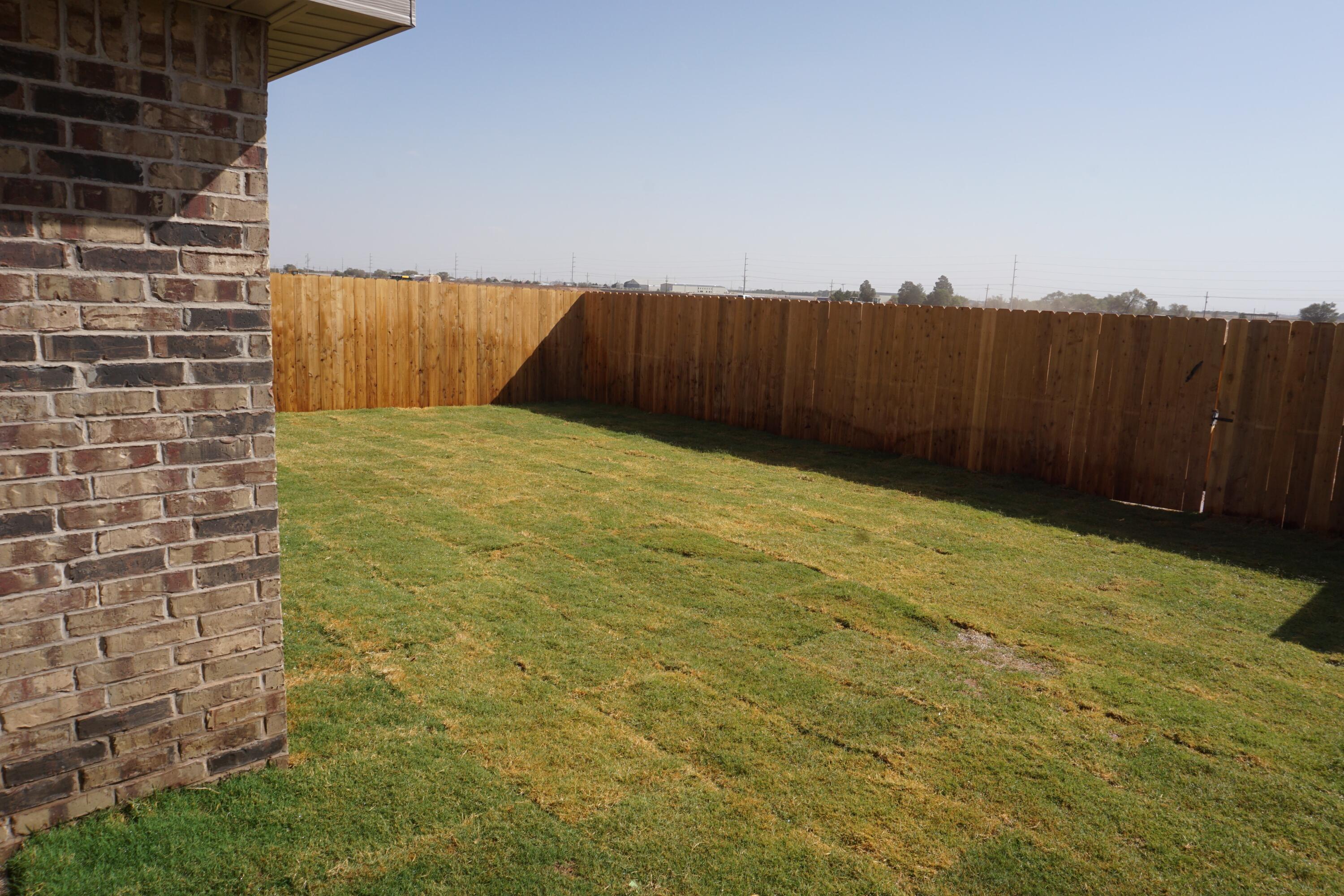 7517 31st Street Lubbock, TX 79407 - Photo 13 of 14 a view of wooden fence