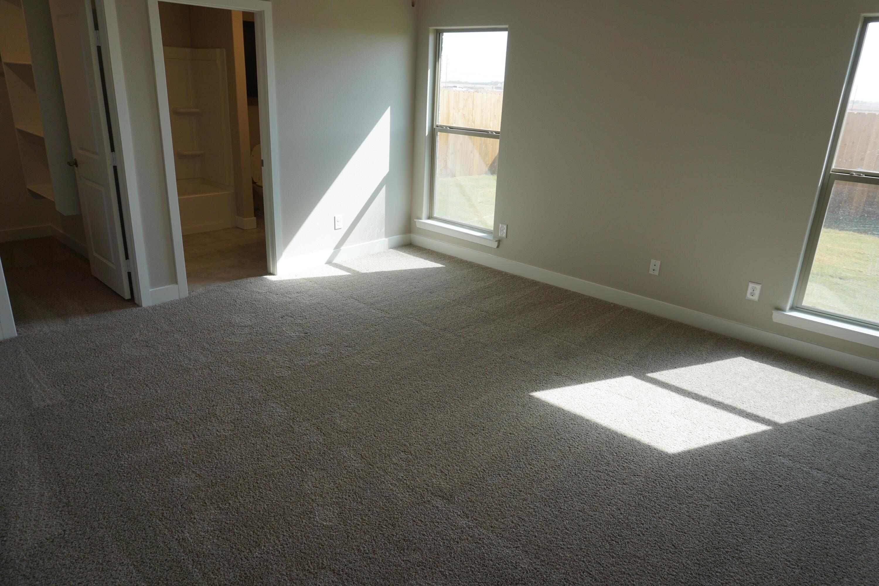 7517 31st Street Lubbock, TX 79407 - Photo 10 of 14 a view of an empty room and a window