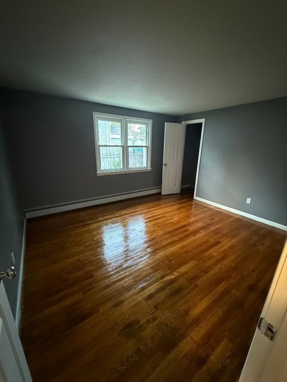 45 Penacook Street Springfield, MA 01104 - Photo 12 of 27 a view of empty room with wooden floor and fan