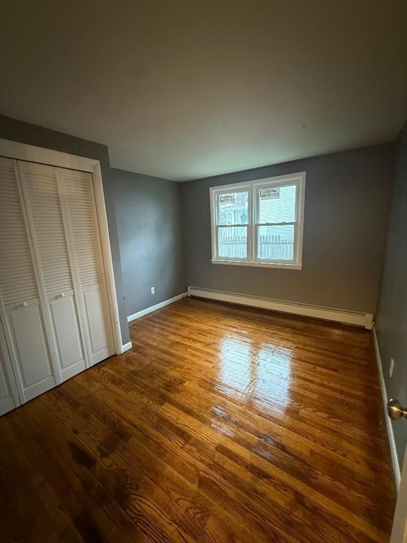 45 Penacook Street Springfield, MA 01104 - Photo 13 of 27 a view of empty room with window and wooden floor