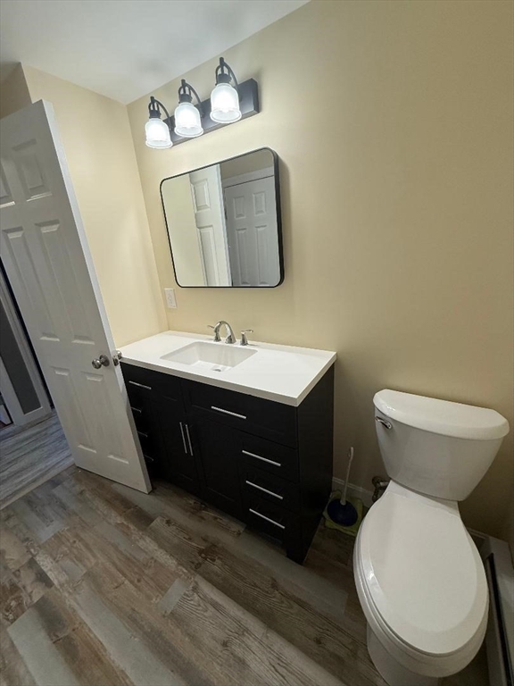 45 Penacook Street Springfield, MA 01104 - Photo 16 of 27 a bathroom with a toilet sink and mirror