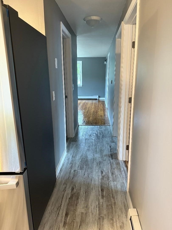 45 Penacook Street Springfield, MA 01104 - Photo 21 of 27 a view of a hallway with wooden floor and staircase