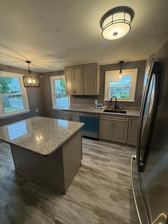 45 Penacook Street Springfield, MA 01104 - Photo 9 of 27 a kitchen with stainless steel appliances granite countertop a sink stove and refrigerator
