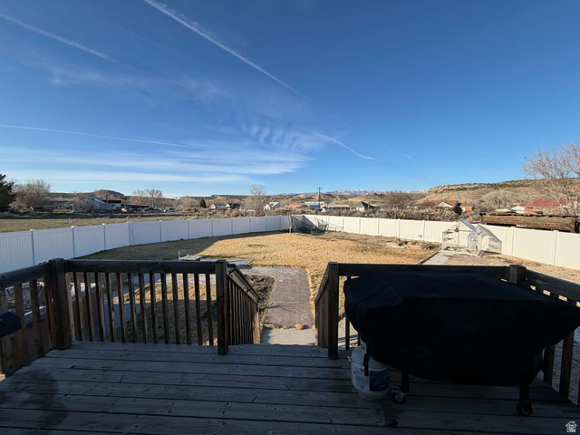 2095 West 4100 North Spring Glen, UT 84526 - Photo 25 of 35 Deck with a fenced backyard, a mountain view, and a residential view