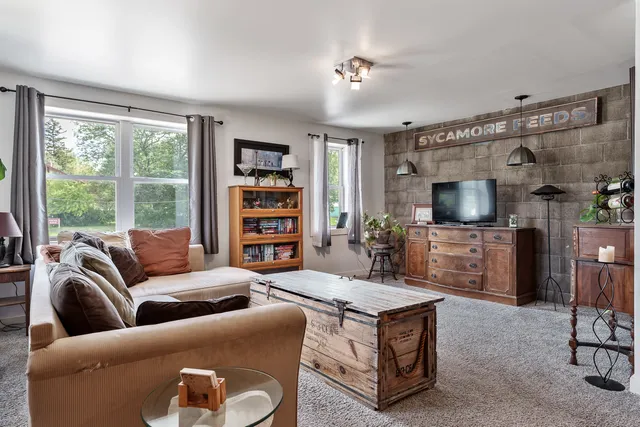 a view of a dining area with furniture and a chandelier