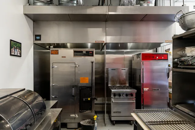 a view of a dining area with furniture and chandelier
