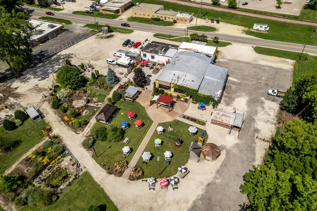 a swimming pool with outdoor seating and yard