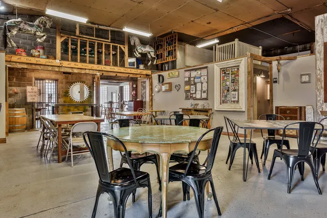 a front view of a house with outdoor seating