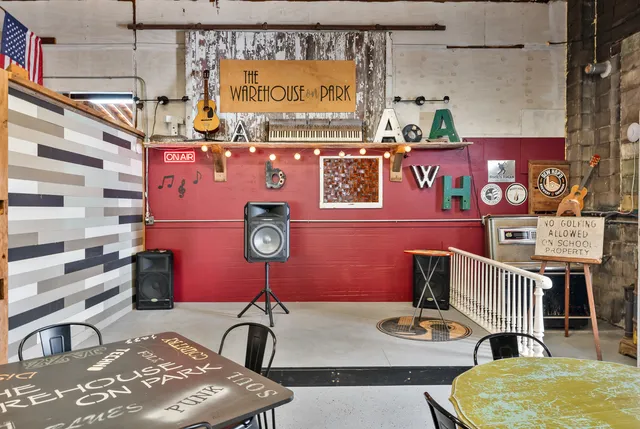 a view of a yard with plants and tree
