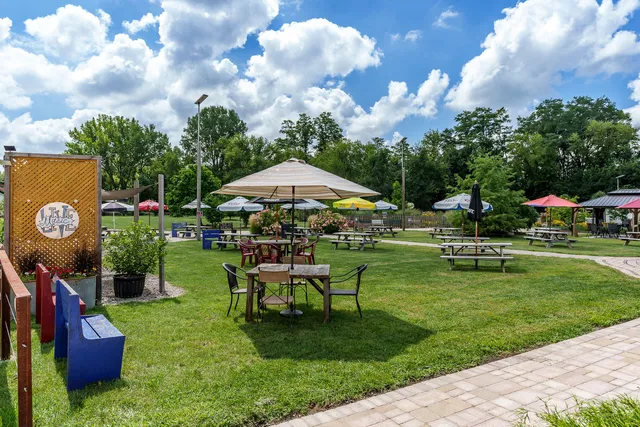 a swimming pool with outdoor seating and yard