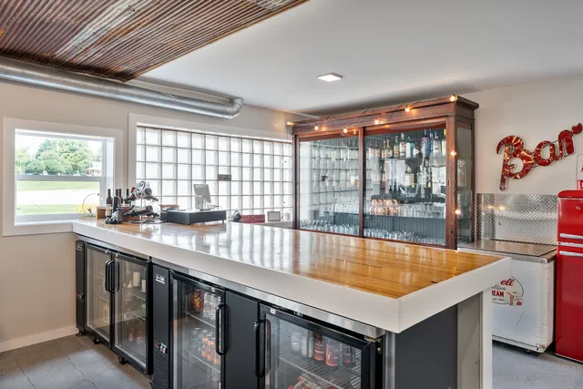 a living room with furniture and a book shelf