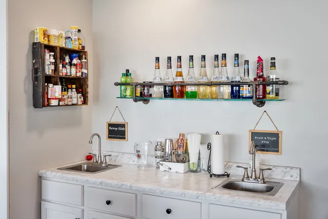 a kitchen with stainless steel appliances a stove a refrigerator and a sink
