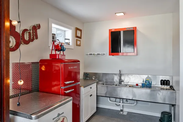 a kitchen with stainless steel appliances a stove a refrigerator and a sink
