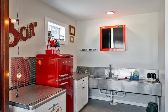 a room with a book shelf and a potted plant on a dresser