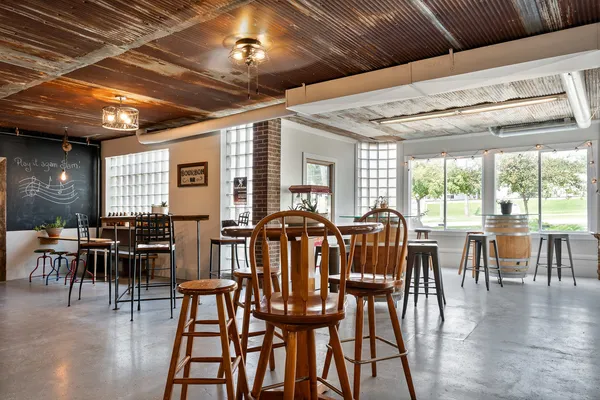 a kitchen with cabinets and a clock on the wall