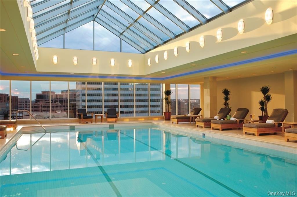 1 Renaissance Square, Unit 10C White Plains, NY 10601 - Photo 23 of 28 a view of a swimming pool with outdoor seating