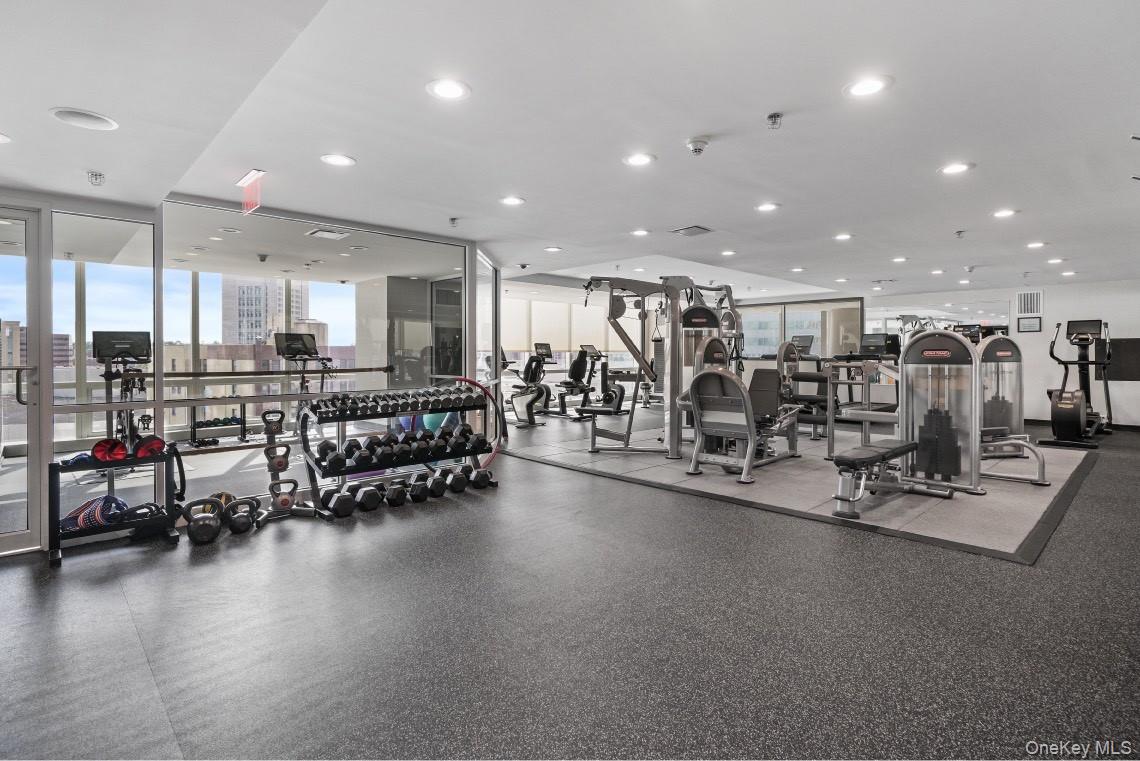 1 Renaissance Square, Unit 10C White Plains, NY 10601 - Photo 24 of 28 a view of a room with gym equipment and mirrors